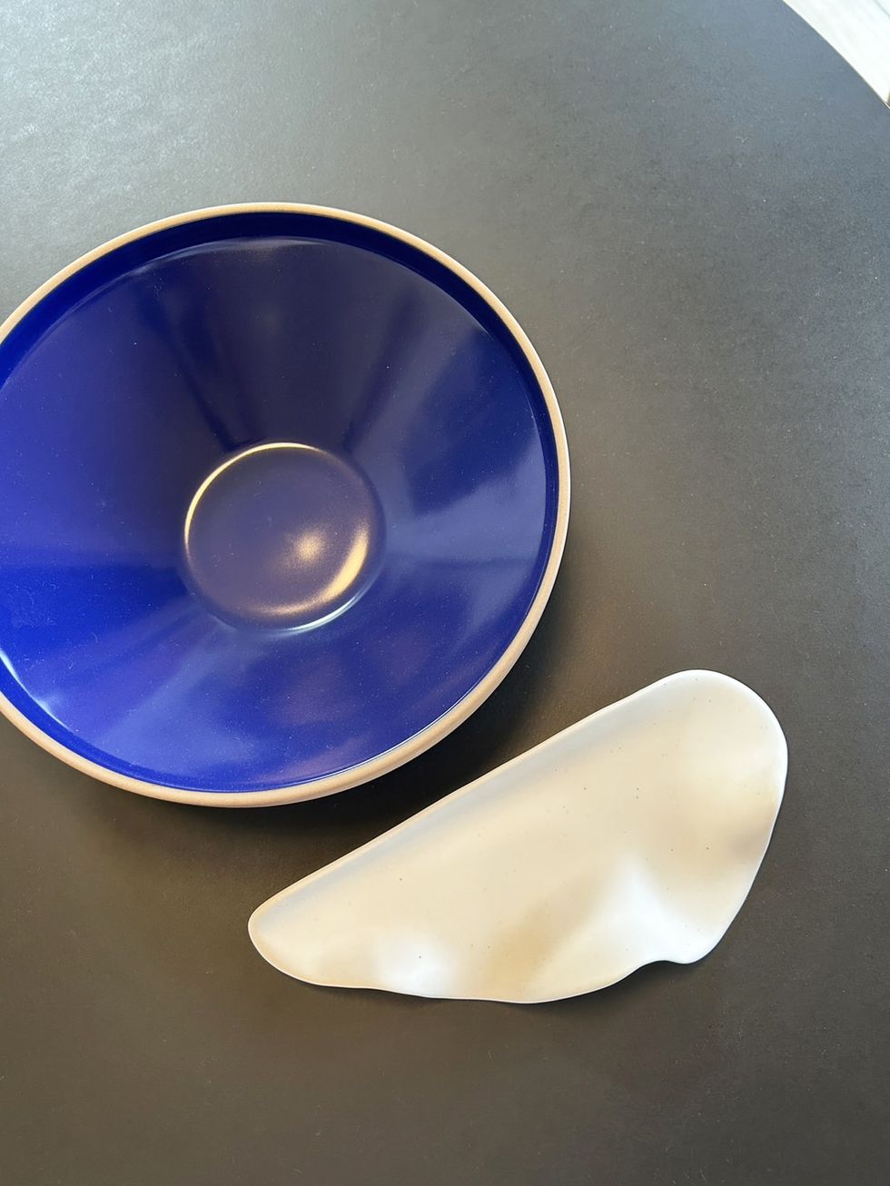 a blue plate with a white object on it