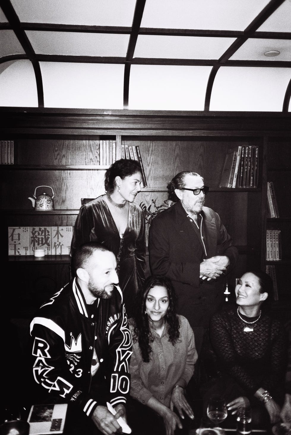 group of people posing together in an indoor setting