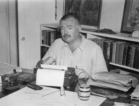 eh5647p           undatedernest hemingway sitting at typewriter, writing on "finca vigia, near san francisco de paula, cuba san francisco de paula cuba" stationary, at finca vigia, near san francisco de paula, cubaplease credit "photographer unknown ernest hemingway collection photographs john f kennedy presidential library and museum, boston"