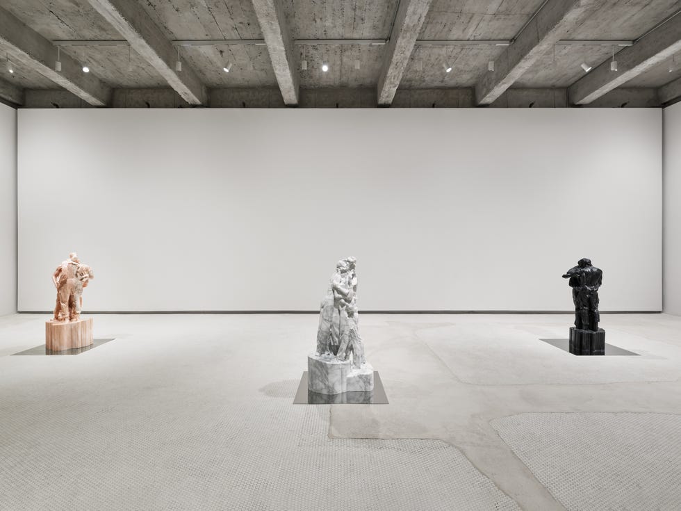 three sculptures displayed in a minimalist gallery setting