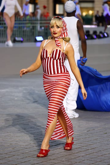sabrina carpenter in a stripe swimsuit dress at the vogue world paris show