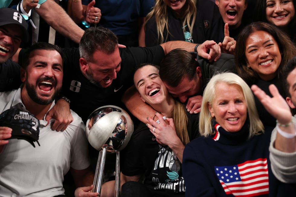 new york, new york october 20 sabrina ionescu 20 of the new york liberty celebrates with the wnba championship trophy and her family after winning game five of the wnba finals at barclays center on october 20, 2024 in new york city photo by elsagetty images