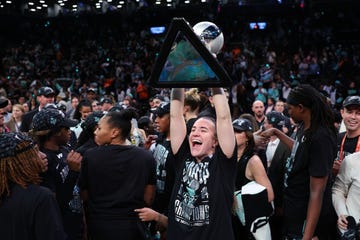 new york, new york october 20 sabrina ionescu 20 of the new york liberty celebrates with the wnba championship trophy after defeating the minnesota lynx to win game five of the wnba finals at barclays center on october 20, 2024 in new york city photo by elsagetty images