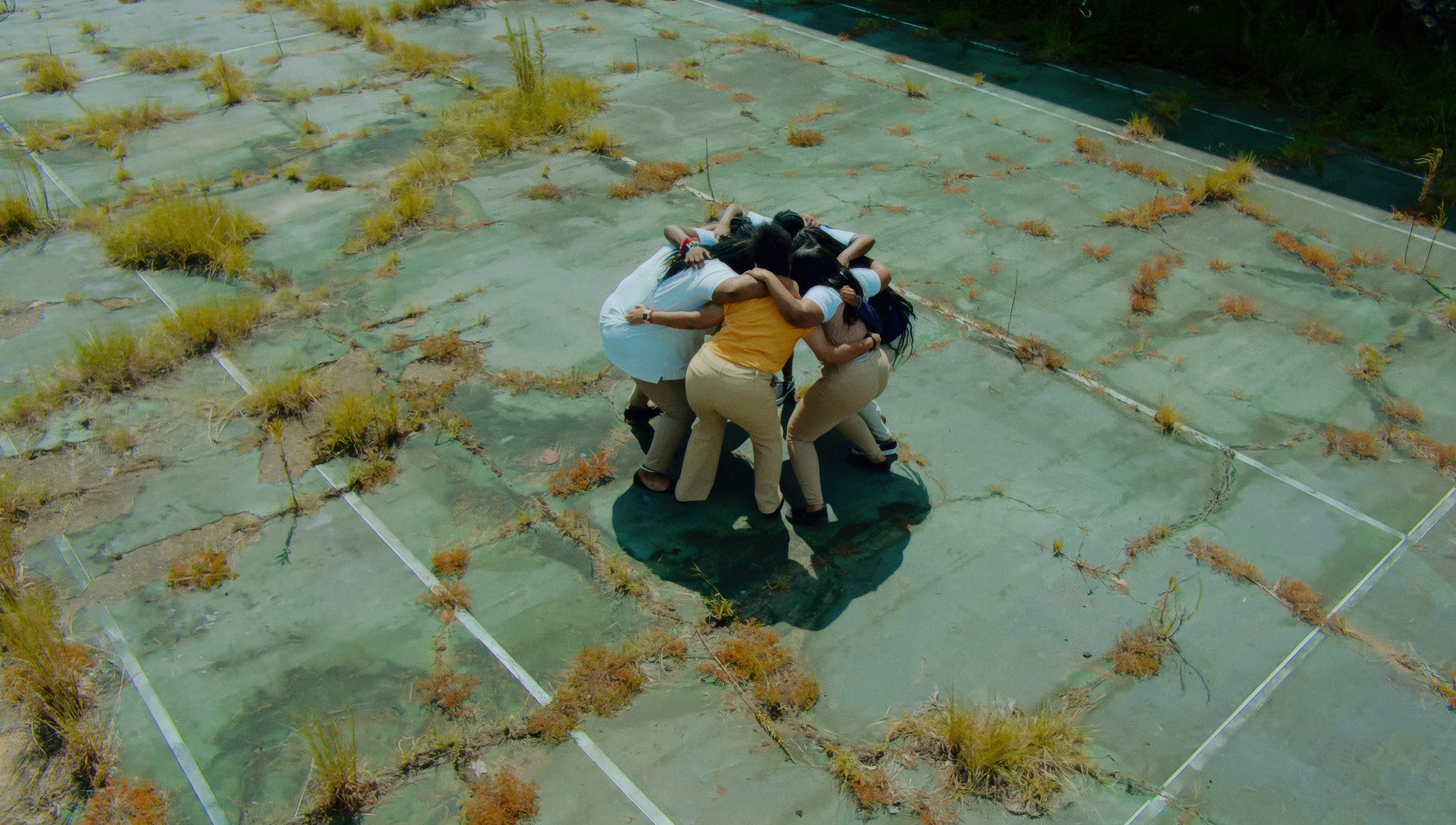 a group of people huddled over