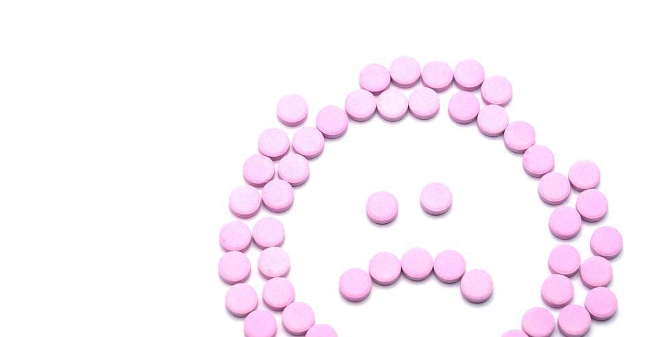 sad unhappy face of pink pills on white background tablets of drug for asthma treatment