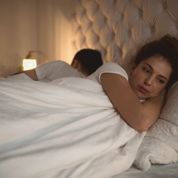 sad woman having problems in bed with her boyfriend