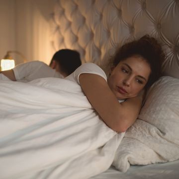 sad woman having problems in bed with her boyfriend
