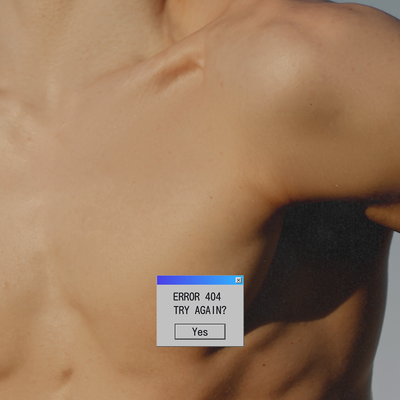 a close up of a person's chest with a tag on it