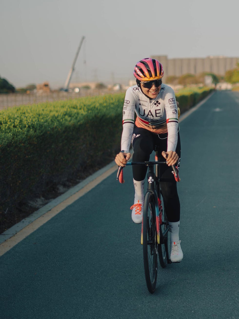 a man riding a bicycle on a road