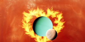 two planets side by side surrounded by a flame heart
