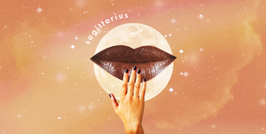 a hand touches a pair of giant lips in front of a full moon and an orange cloudy sky the word "sagittarius" can be seen over the moon