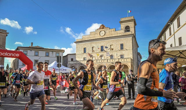 runners participating in a race in a town square