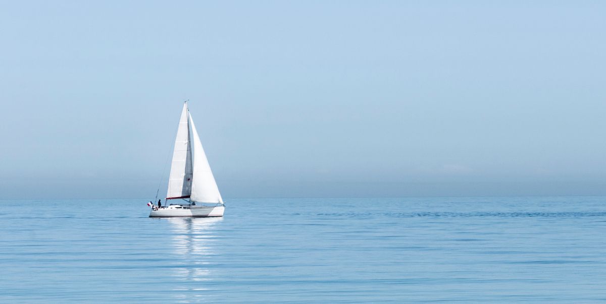 sailboat sailing on sea against clear sky