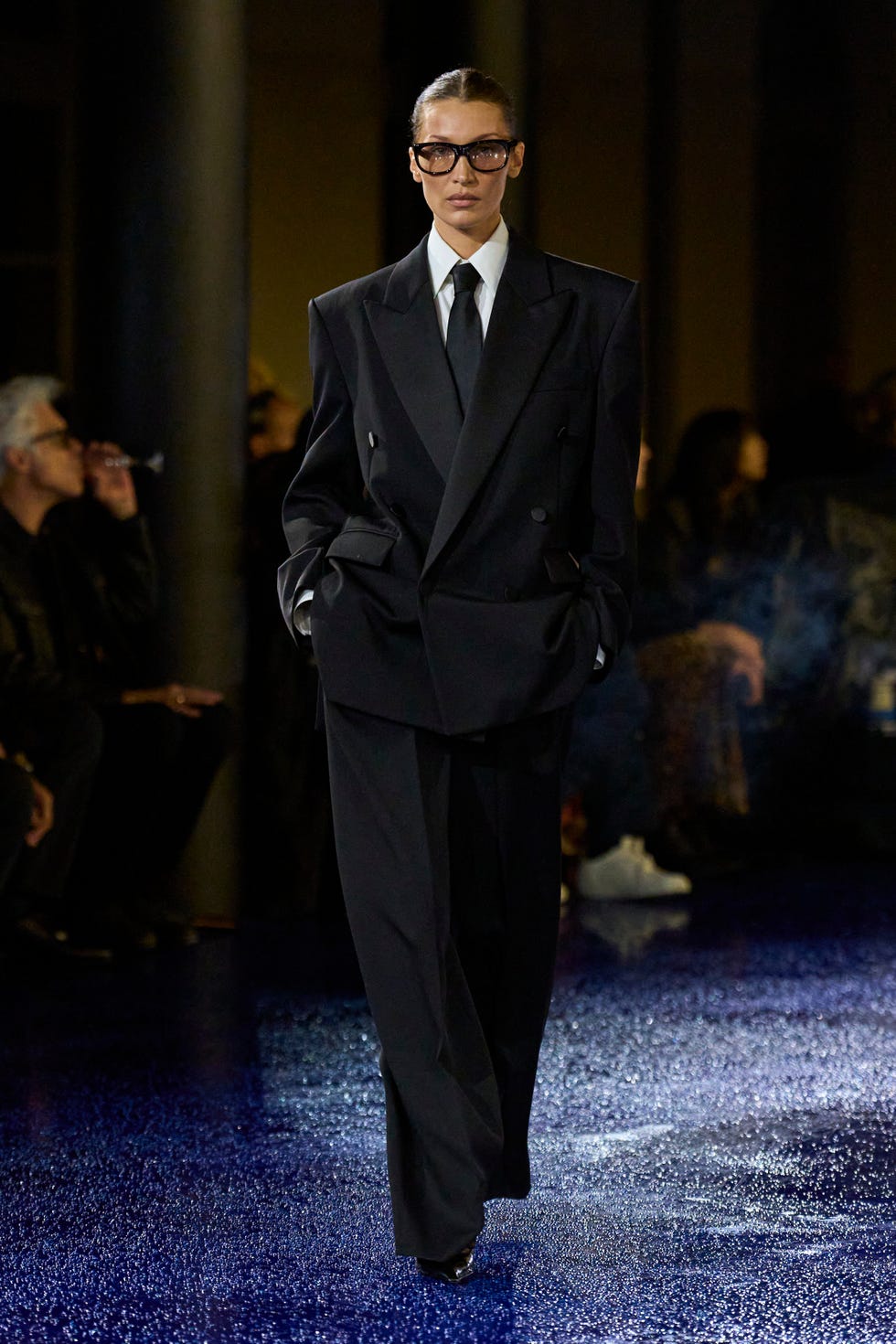 bella hadid wearing a suit and tie in the saint laurent springsummer 2025 runway show