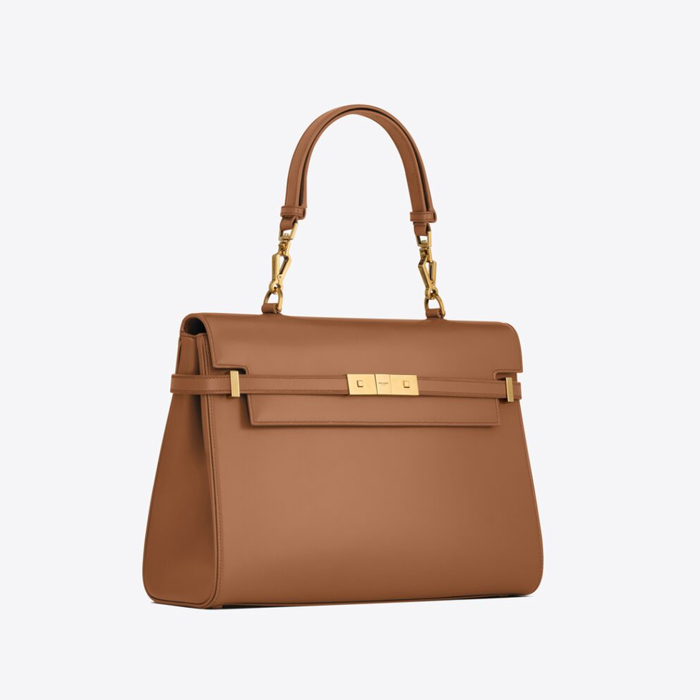 a brown handbag with a strap