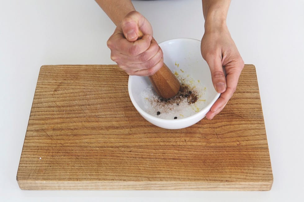 Mortar and pestle, Cutting board, Hand, Wood stain, Food, Wood, Cuisine, Recipe, Hardwood, Kitchen utensil, 