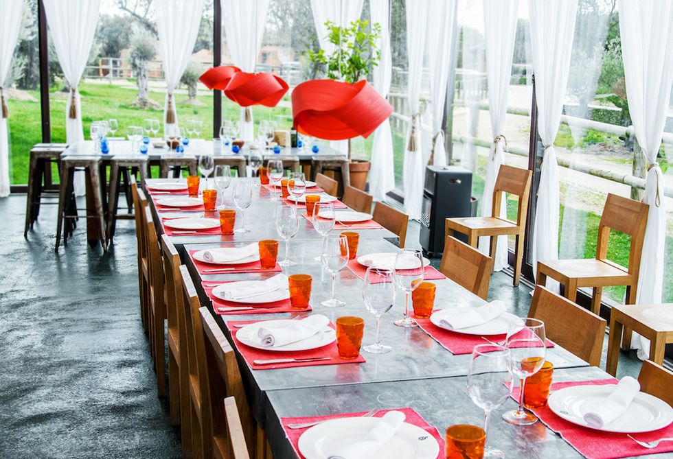 Red, Table, Restaurant, Rehearsal dinner, Brunch, Tablecloth, Furniture, Meal, Chair, Textile, 