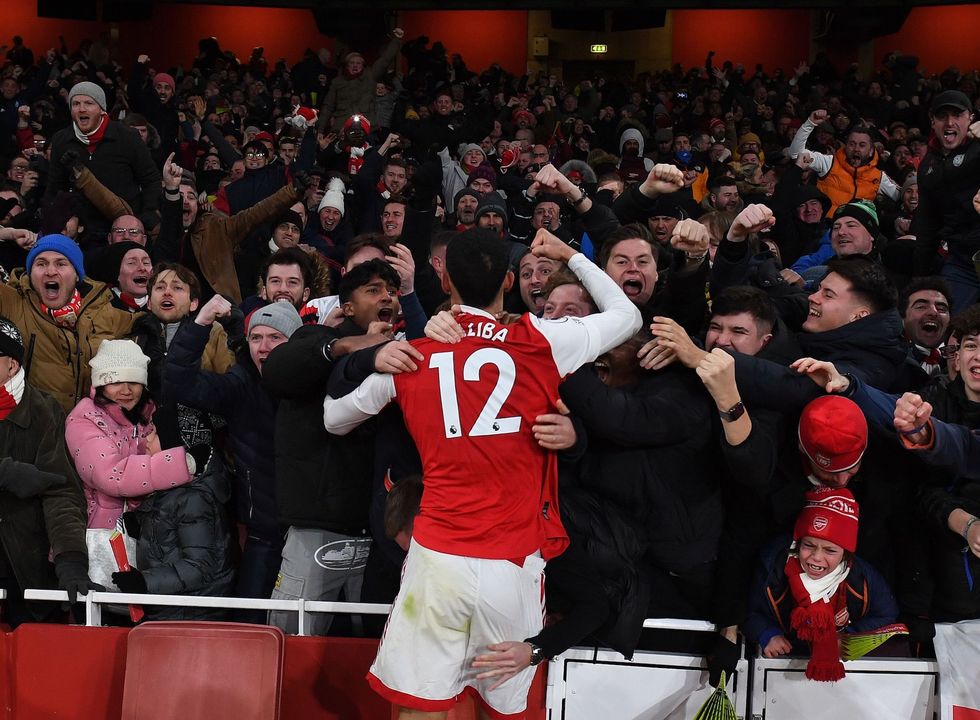 london, england january 22 william saliba celebrates the 3rd goal with the arsenal fans during the premier league match between arsenal fc and manchester united at emirates stadium on january 22, 2023 in london, england photo by stuart macfarlanearsenal fc via getty images