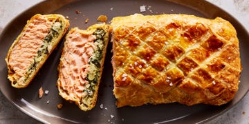 layers of salmon and cream spinach inside of puff pastry