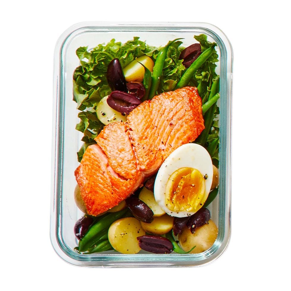 salmon niçoise salad in a glass container