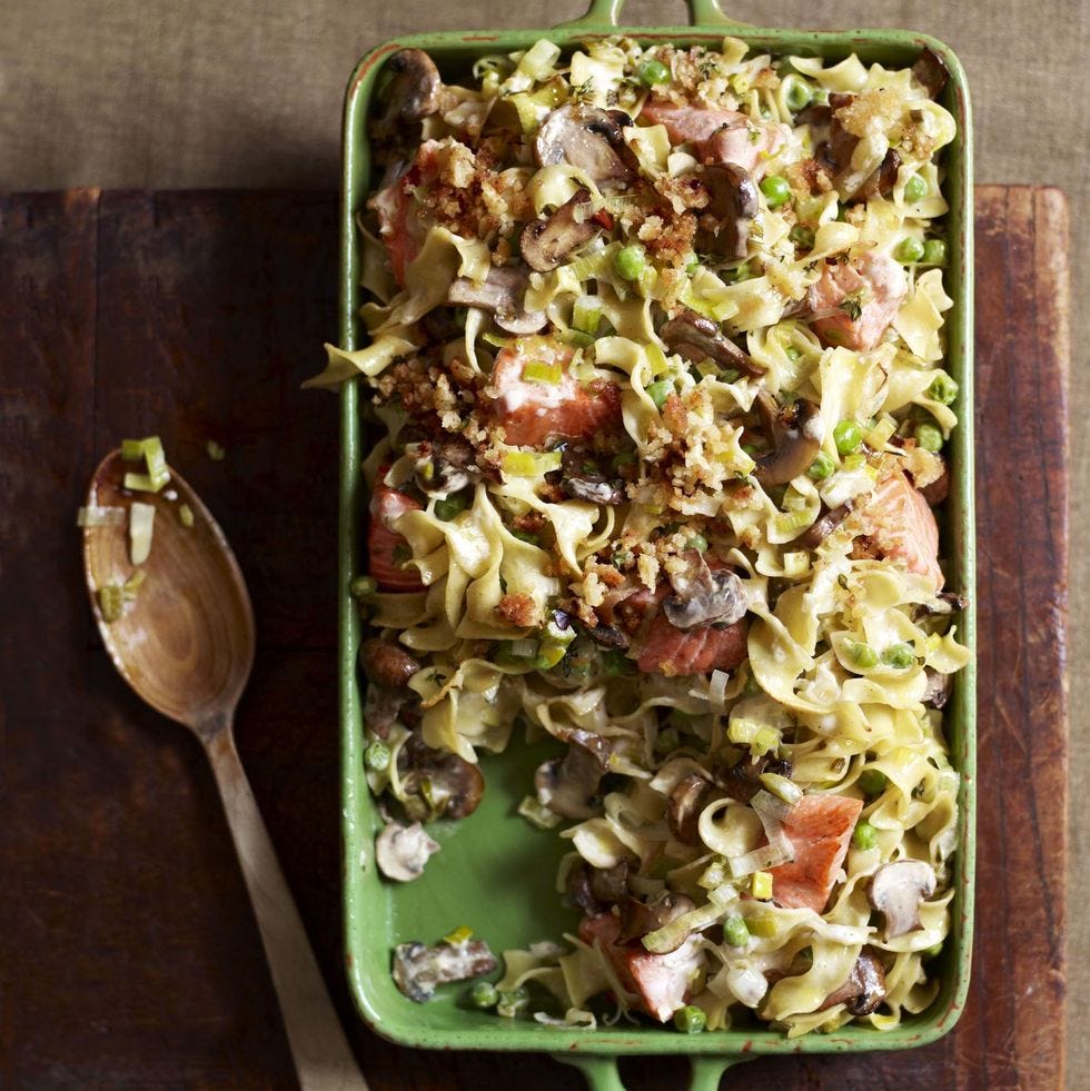 salmon noodle bake in a green casserole dish