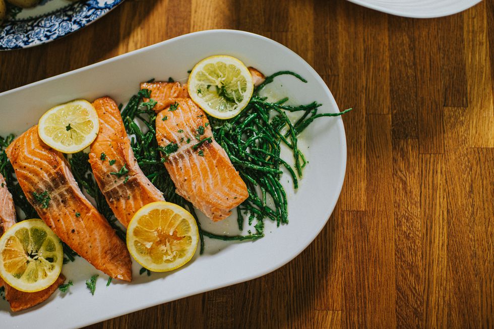 healthy living salmon on a serving plate on a desk