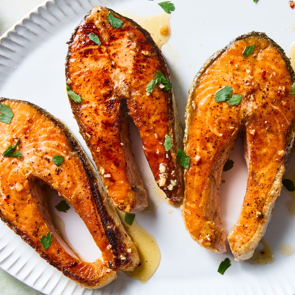 salmon steaks garnished with butter and parsley