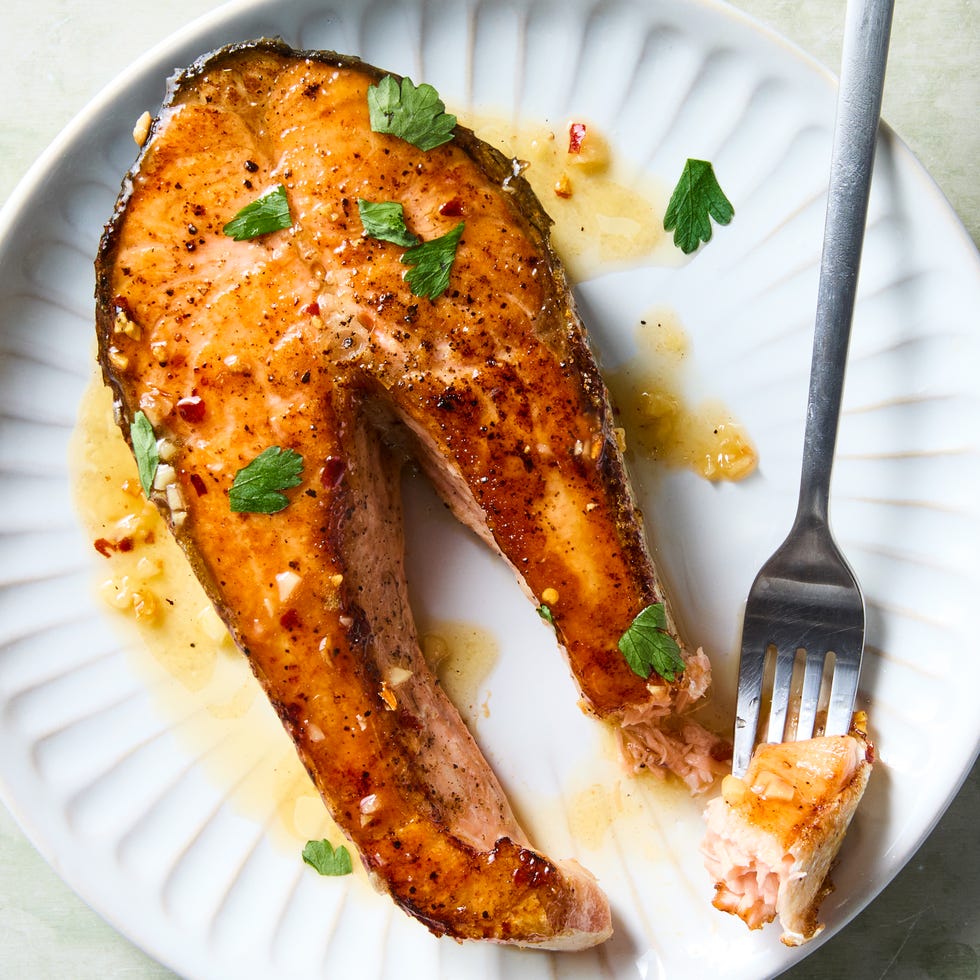 salmon steaks garnished with butter and parsley