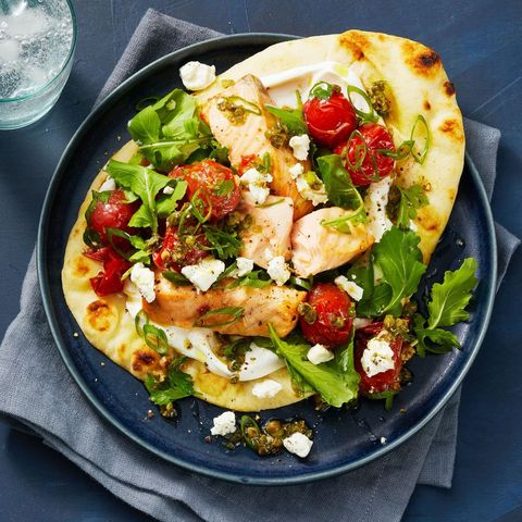 air fryer salmon with herbs and tomatoes on flatbreads