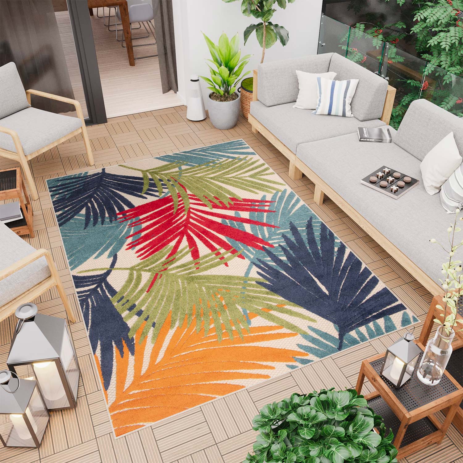 salón exterior en el patio con alfombra de colores