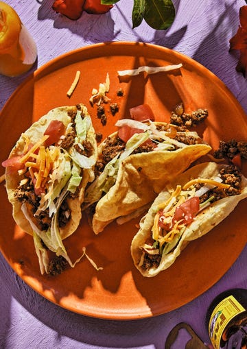 puffy tacos on an orange plate