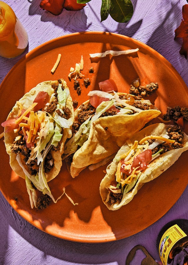 puffy tacos on an orange plate