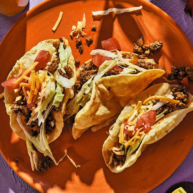 puffy tacos on an orange plate puffy tacos on an orange plate
