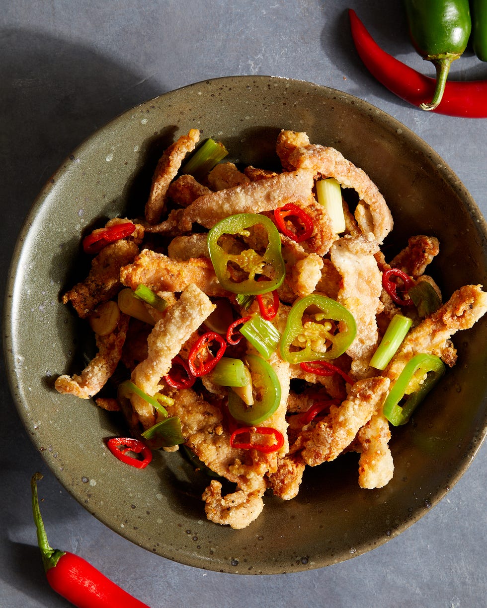 salt and pepper pork chops topped with green and red peppers