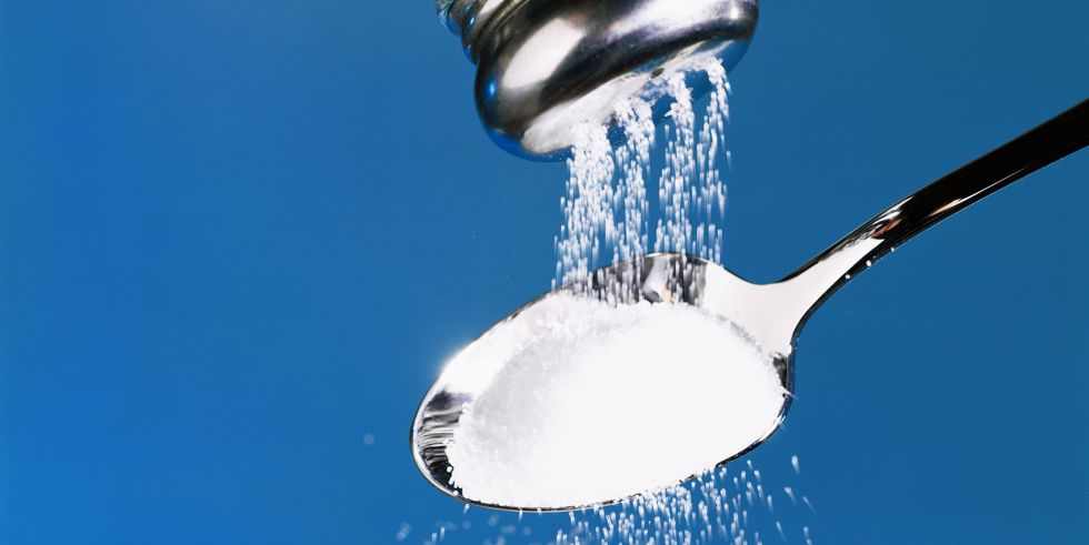 salt pouring into spoon