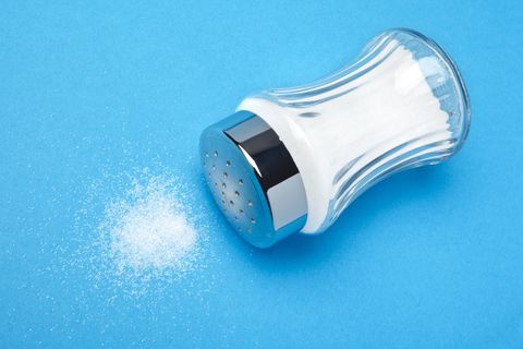 salt shaker tipped on its side spilling salt