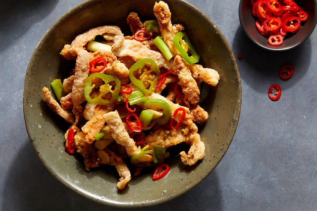 crispy strips of salt and pepper pork chops topped with chilis and scallions
