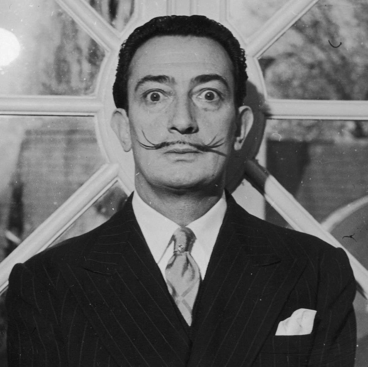 Salvador DaliPortrait of Spanish surrealist artist Salvador Dali (1904 - 1989). He is wearing a pinstriped suit and his trademark mustache. (Photo by Hulton Archive/Getty Images)