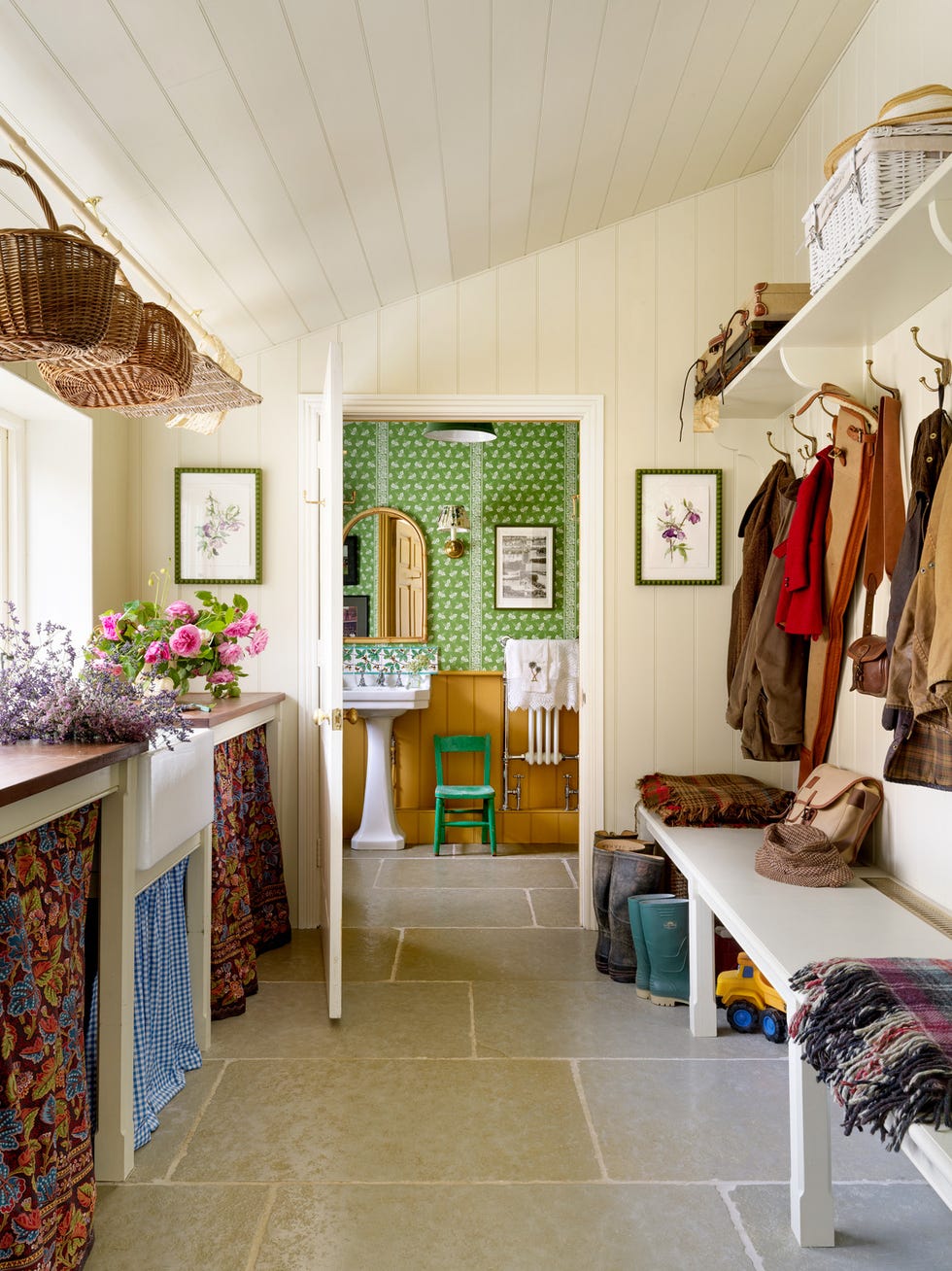 mary graham's pebble dash millhouse on an exposed slope above the river ure, set in traditional farmland in the north of england limestone flooring grounds the boot room and connecting loo fern stripe negative wallpaper\, mond designs