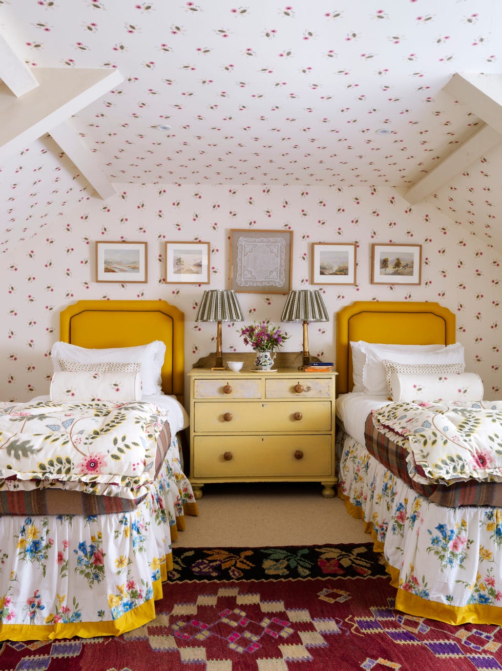 mary graham's pebble dash millhouse on an exposed slope above the river ure, set in traditional farmland in the north of england a pine victorian chest is flanked by twin beds dressed in cologne cotton bed linens