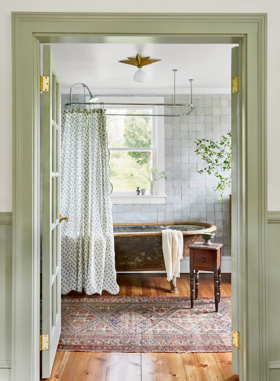 bathroom with a vintage bathtub shower curtain and wooden accents