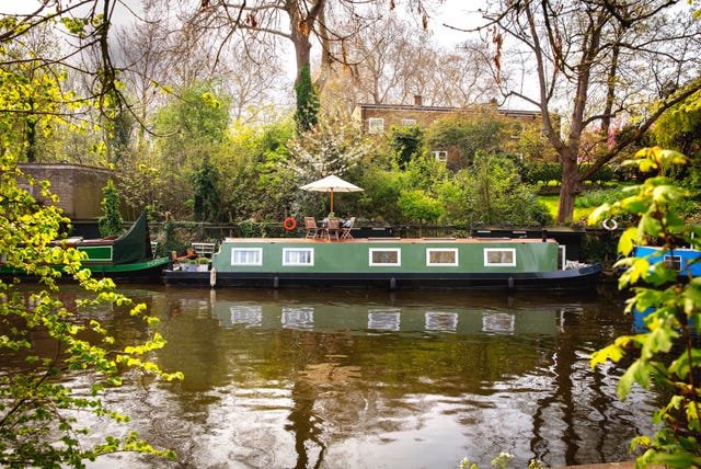 green canal boat river and trees