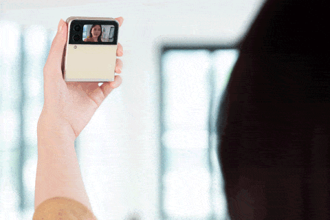 person taking selfie on samsung galaxy z flip3 smartphone