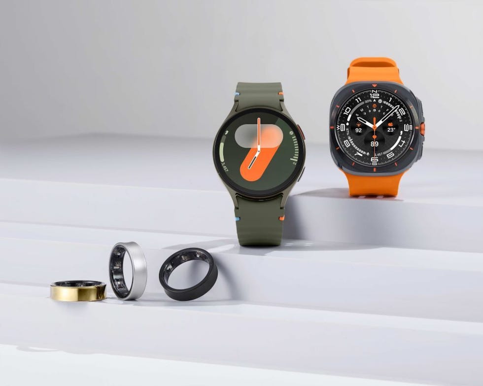 smartwatches and rings displayed on a minimalistic surface
