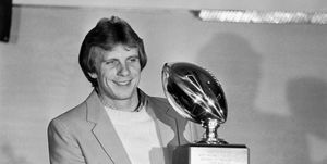 joe montana holds most valuable player trophy