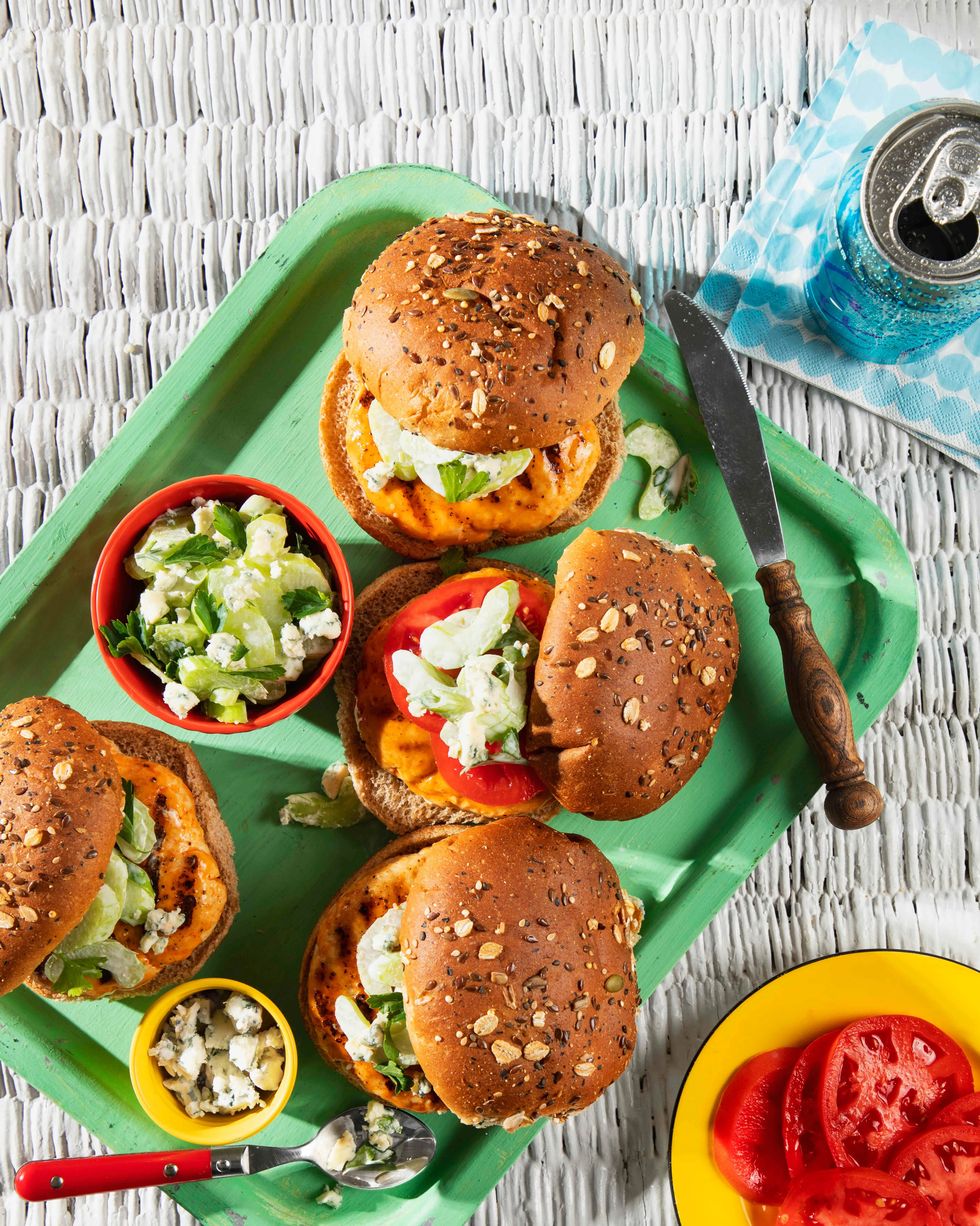 turkey burgers with blue cheese celery slaw on a green serving tray