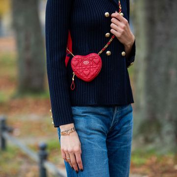 berlin, germany october 27 mandy bork is seen wearing dior double breasted jacket and red bag in heart shape, citizens humanity jeans, linda farrow sunglasses, bottega veneta boots on october 27, 2021 in berlin, germany photo by christian vieriggetty images