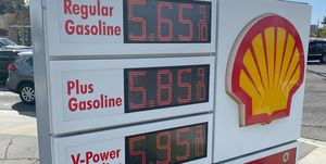 sign showing gas prices above five dollars per gallon