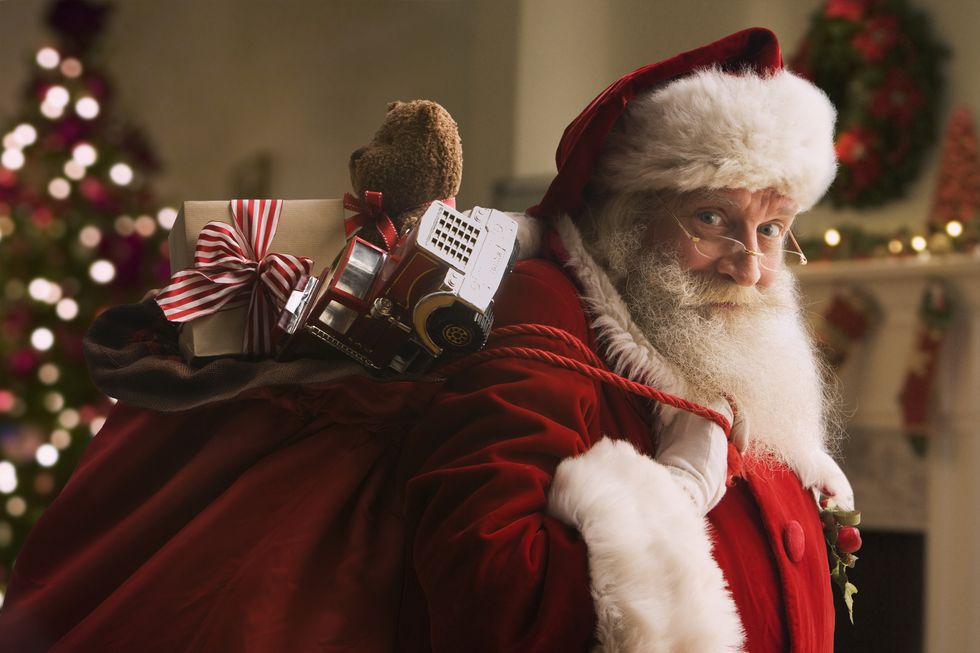 santa claus carrying sack of gifts, portrait, close up