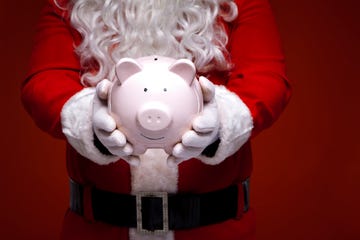 santa claus con hucha de cerdo